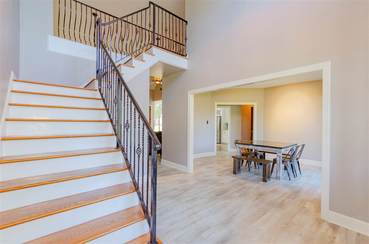 9487 Osborn Road Arlington, TN 38002 - Photo 3 of 23 a view of a dining room with wooden floor and a chandelier