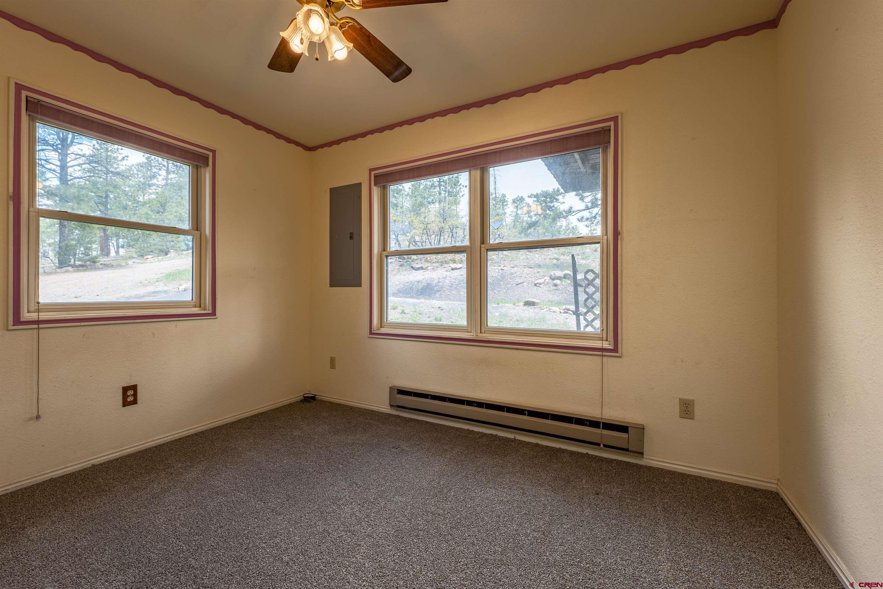 177 Spur Lane Durango, CO 81301 - Photo 15 of 34 a view of an empty room with a window