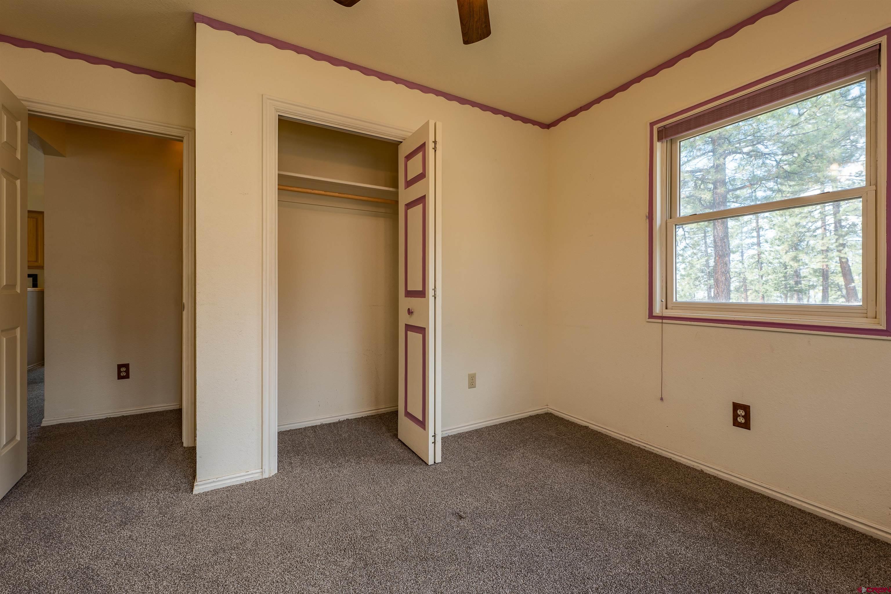177 Spur Lane Durango, CO 81301 - Photo 16 of 34 an empty room with a window