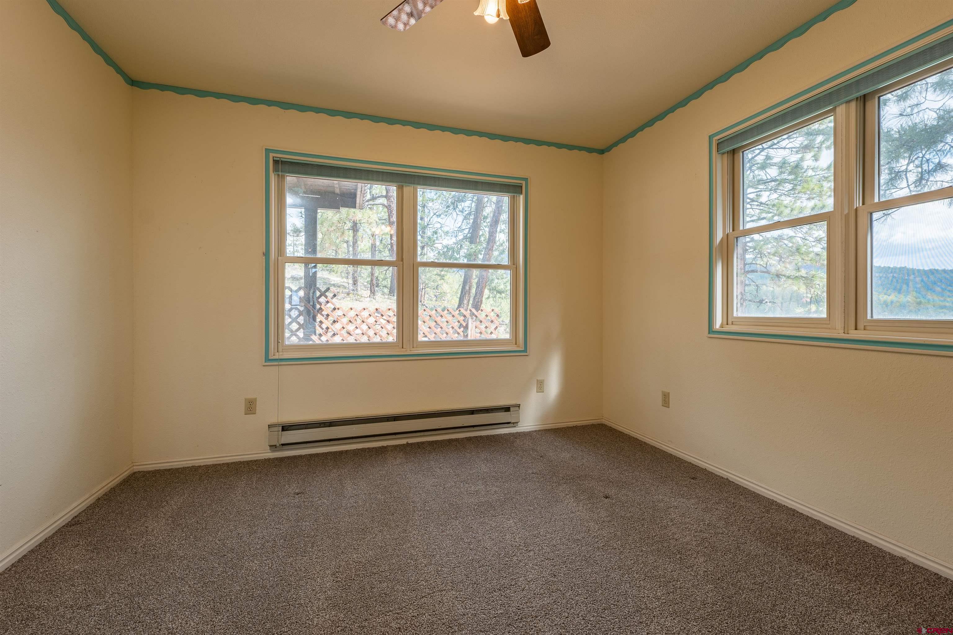 177 Spur Lane Durango, CO 81301 - Photo 19 of 34 an empty room with windows