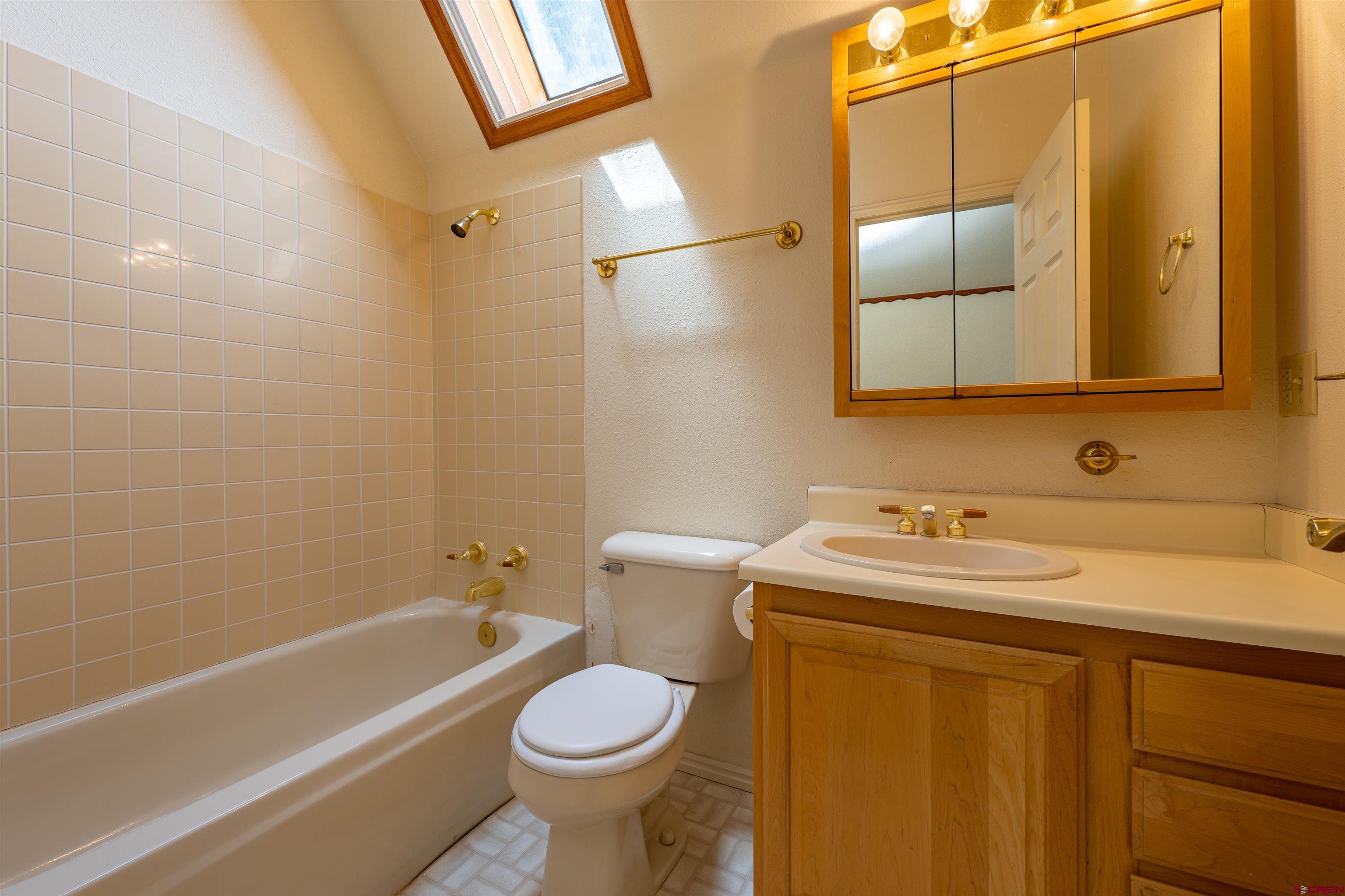 177 Spur Lane Durango, CO 81301 - Photo 22 of 34 a bathroom with a sink toilet and shower
