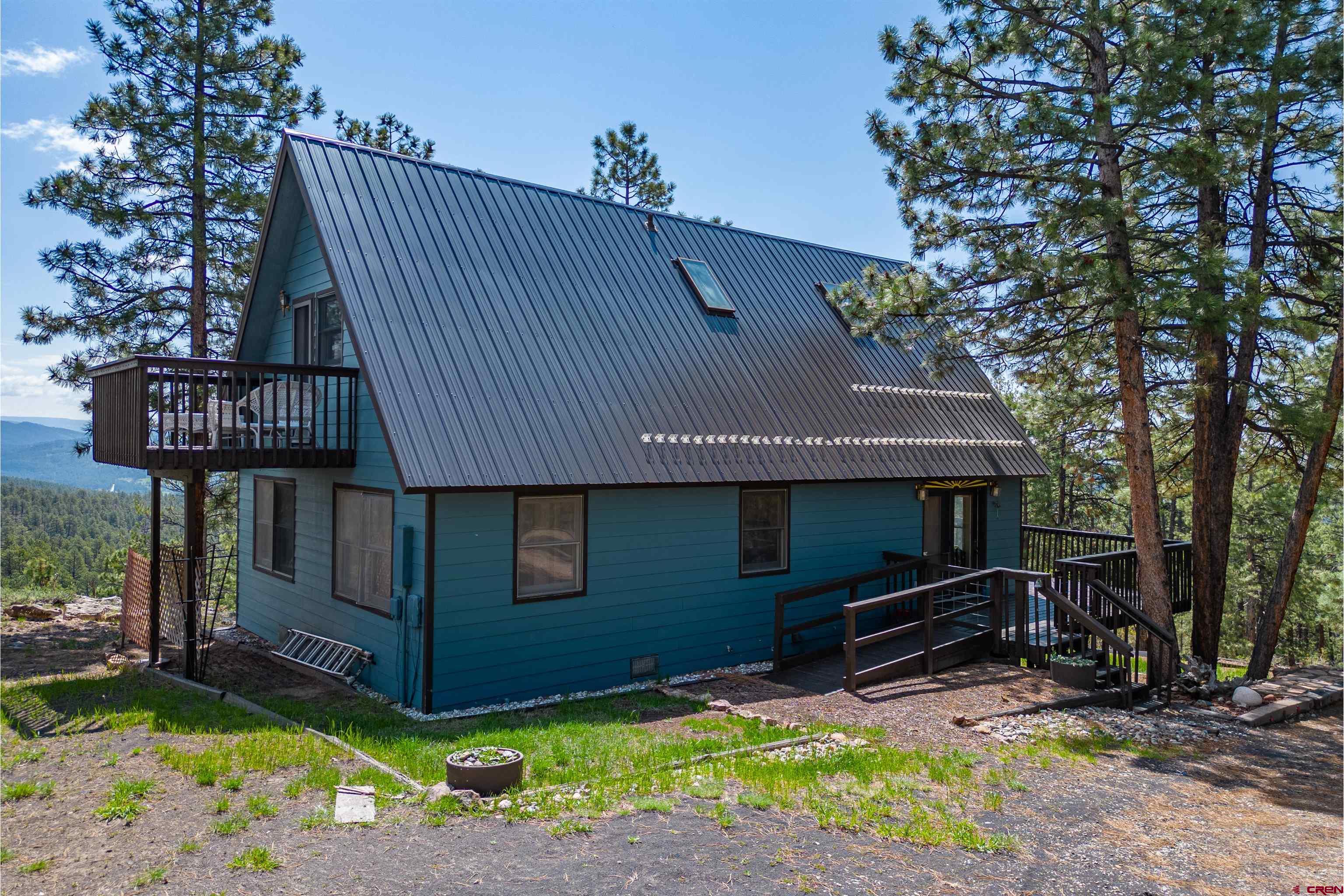 177 Spur Lane Durango, CO 81301 - Photo 23 of 34 a front view of a house with garden