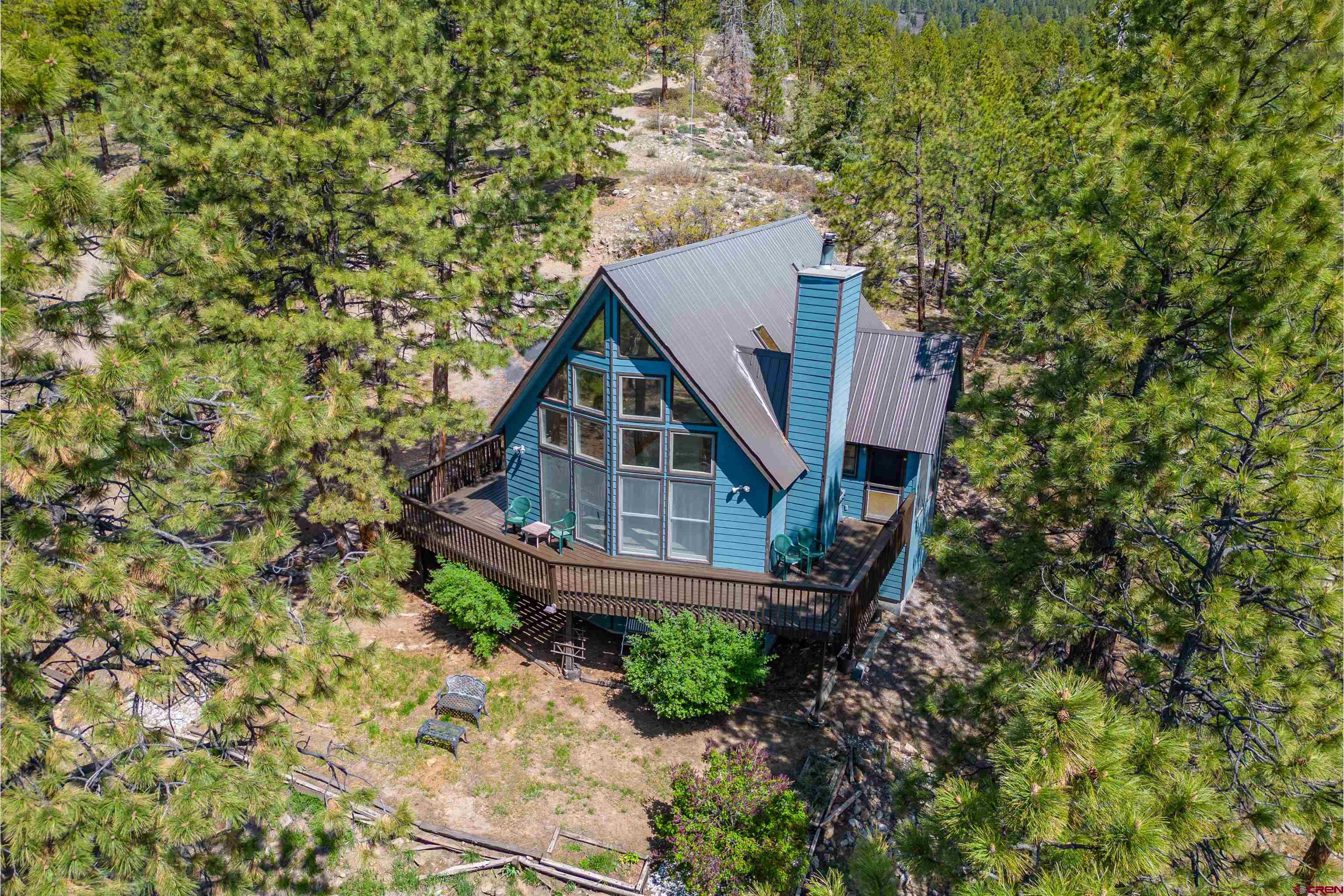 177 Spur Lane Durango, CO 81301 - Photo 26 of 34 a house with trees in front of it
