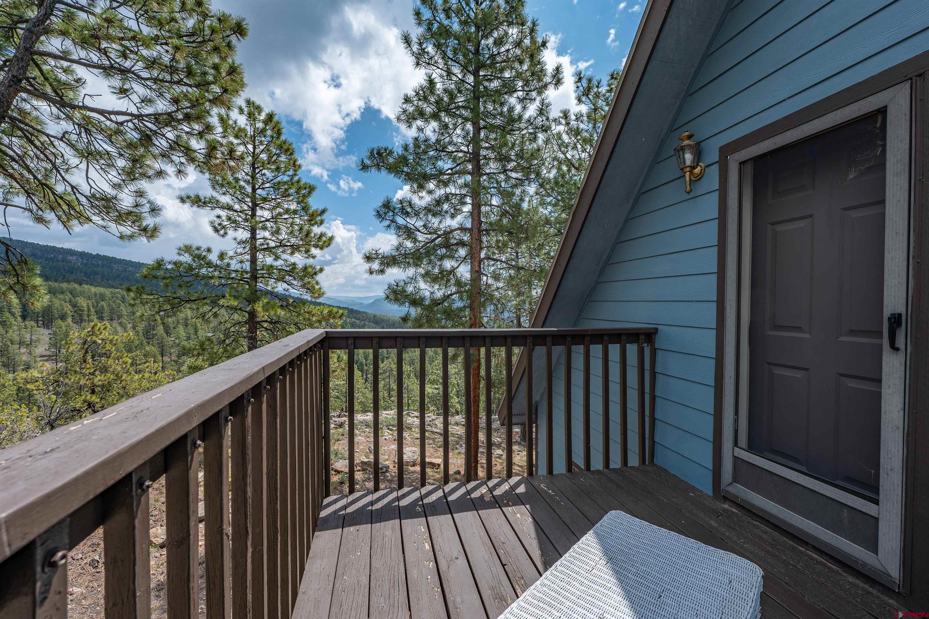 177 Spur Lane Durango, CO 81301 - Photo 29 of 34 a balcony with wooden floor in front of it