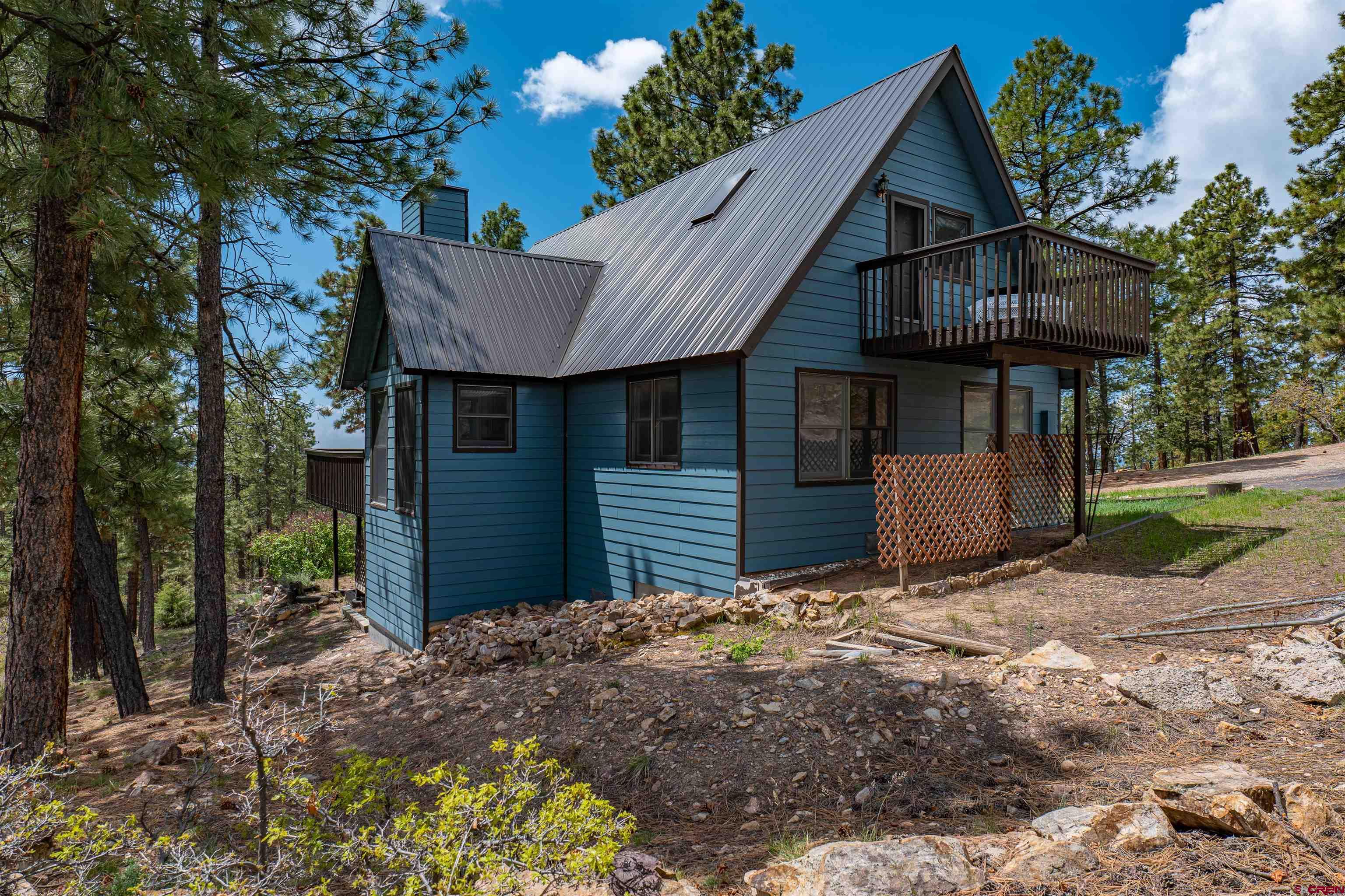 177 Spur Lane Durango, CO 81301 - Photo 34 of 34 a front view of a house with a garden