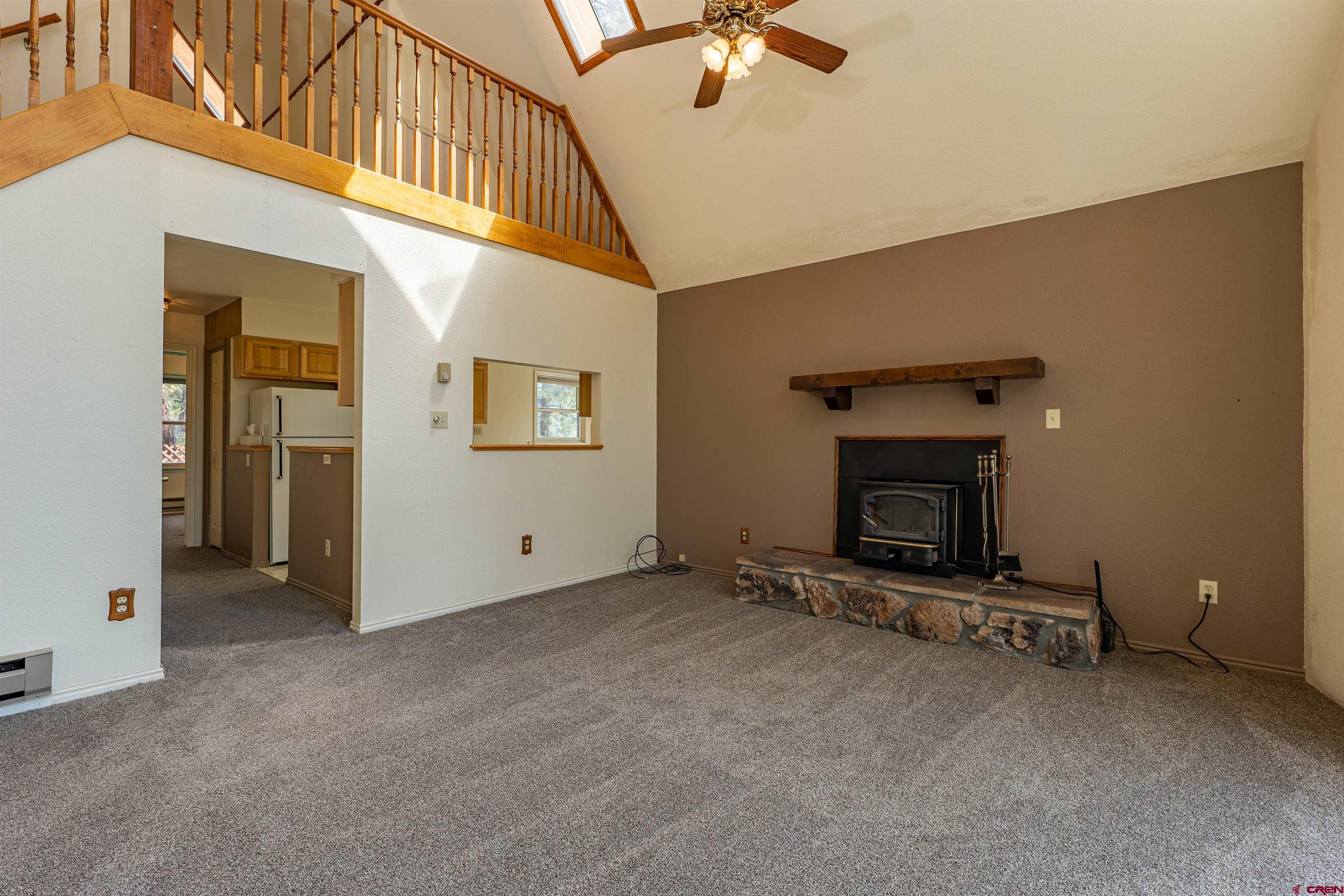 177 Spur Lane Durango, CO 81301 - Photo 5 of 34 a view of an empty room with a fireplace