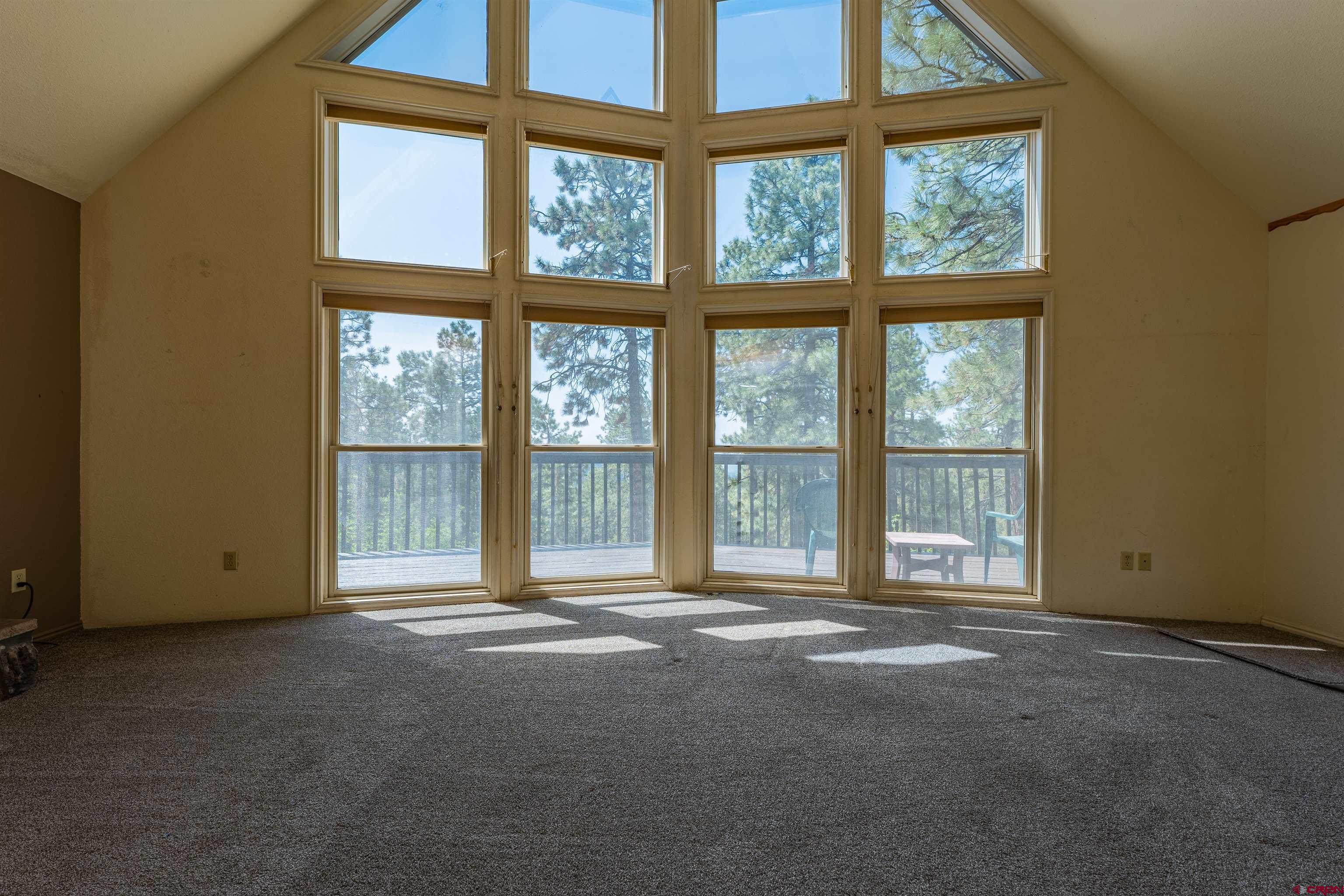 177 Spur Lane Durango, CO 81301 - Photo 6 of 34 a view of an empty room with a large window