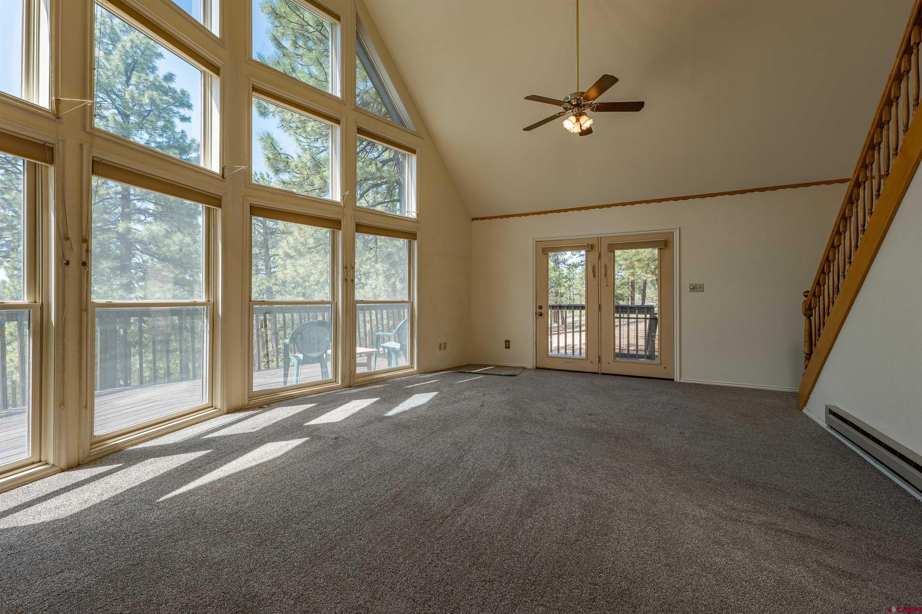 177 Spur Lane Durango, CO 81301 - Photo 7 of 34 a view of an empty room with a window