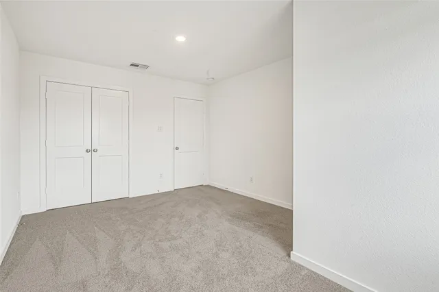 a bathroom with a granite countertop sink and a bathtub