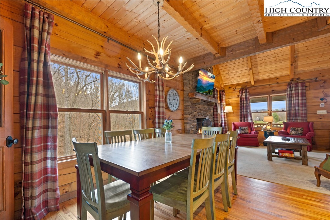337 Rivers Crest Road Boone, NC 28607 - Photo 12 of 45 a view of a patio with dining table and chairs