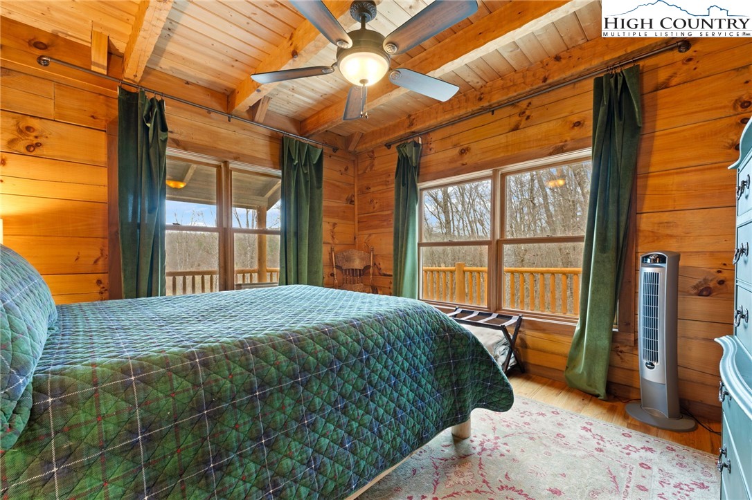 337 Rivers Crest Road Boone, NC 28607 - Photo 15 of 45 a bedroom with a large bed and a large window
