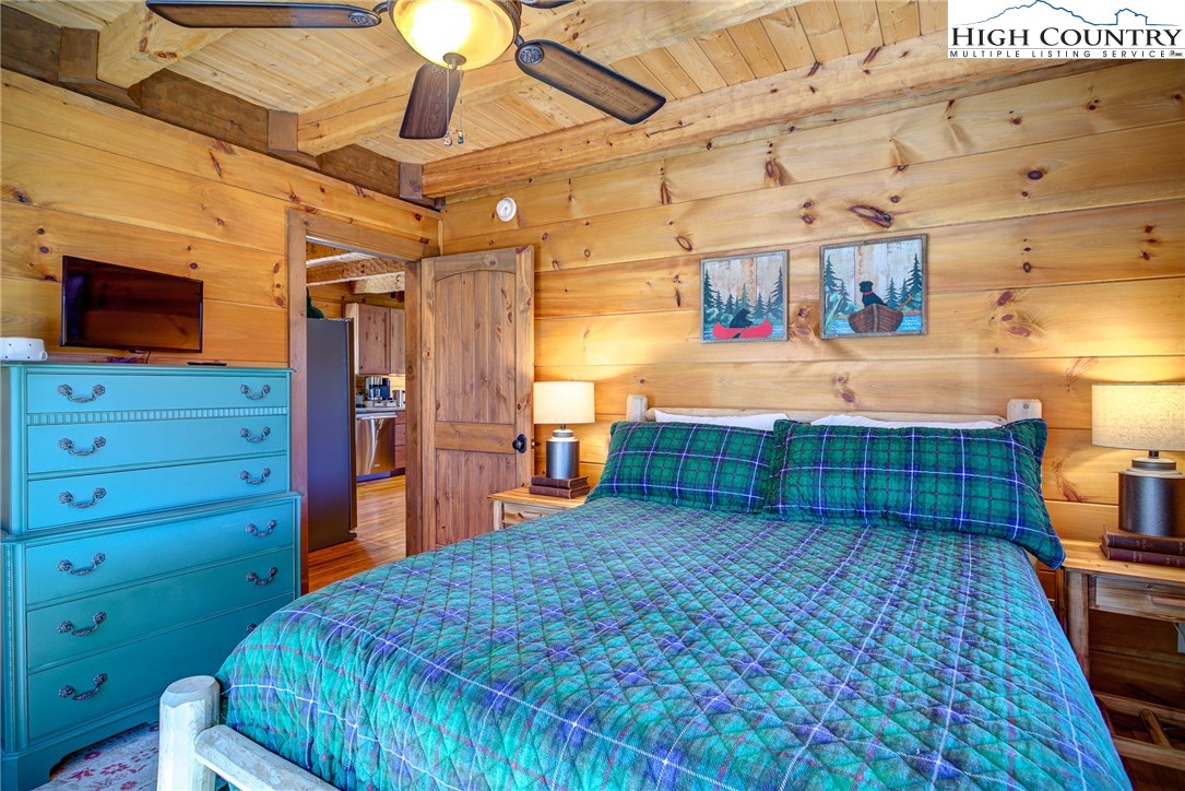 337 Rivers Crest Road Boone, NC 28607 - Photo 17 of 45 a bed room with a bed and a television