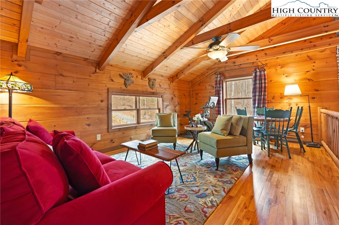 337 Rivers Crest Road Boone, NC 28607 - Photo 19 of 45 a living room with furniture and wooden floor