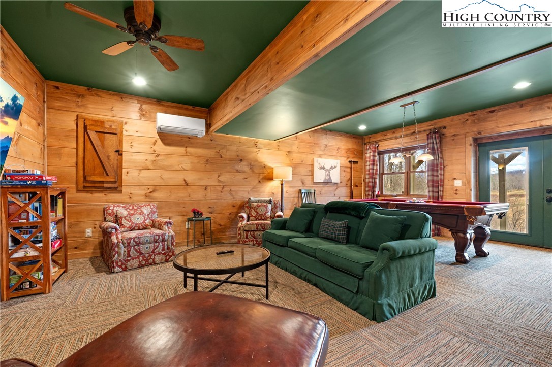 337 Rivers Crest Road Boone, NC 28607 - Photo 24 of 45 a living room with furniture and a large window