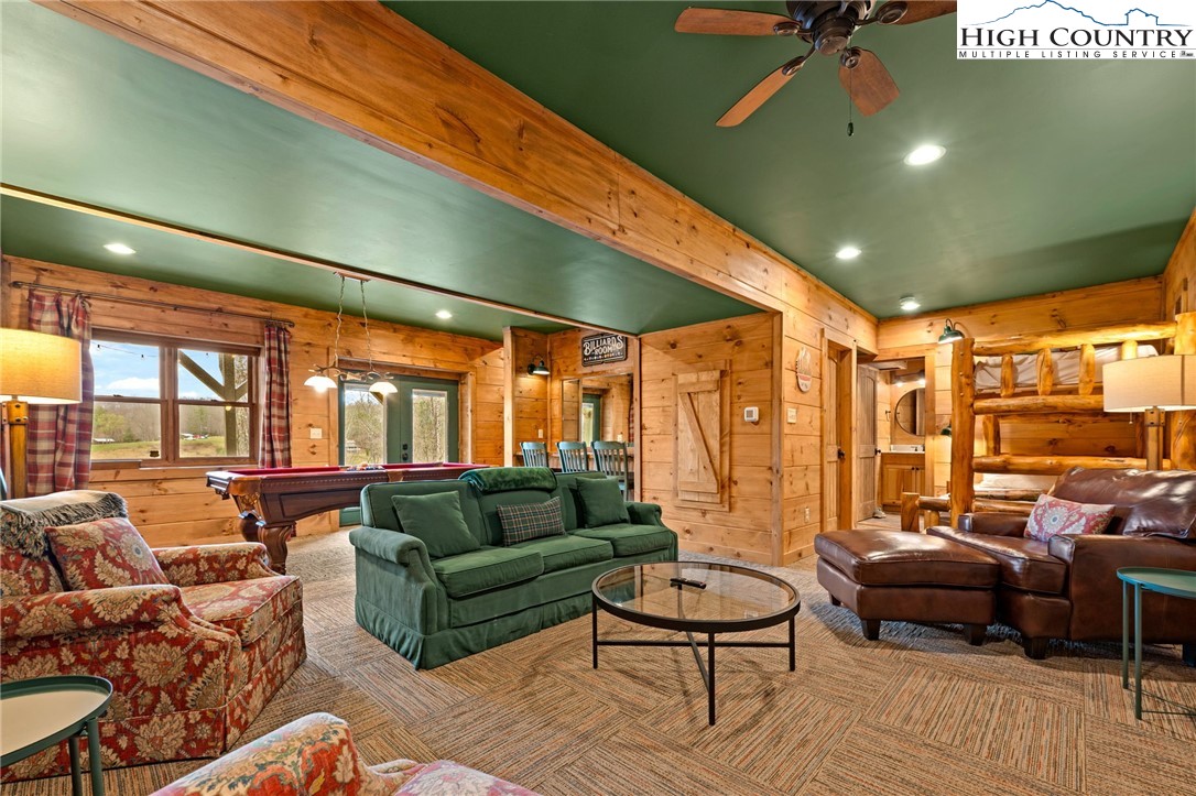 337 Rivers Crest Road Boone, NC 28607 - Photo 25 of 45 a living room with furniture and a large window