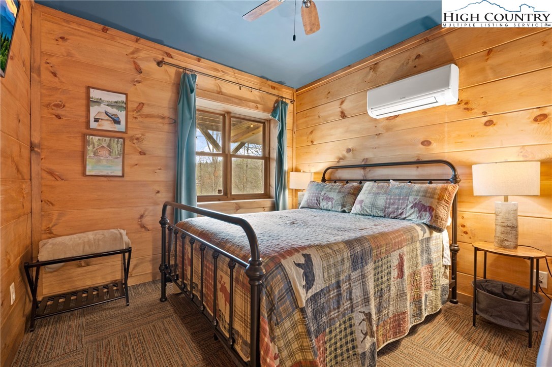 337 Rivers Crest Road Boone, NC 28607 - Photo 27 of 45 a bedroom with a bed and a window