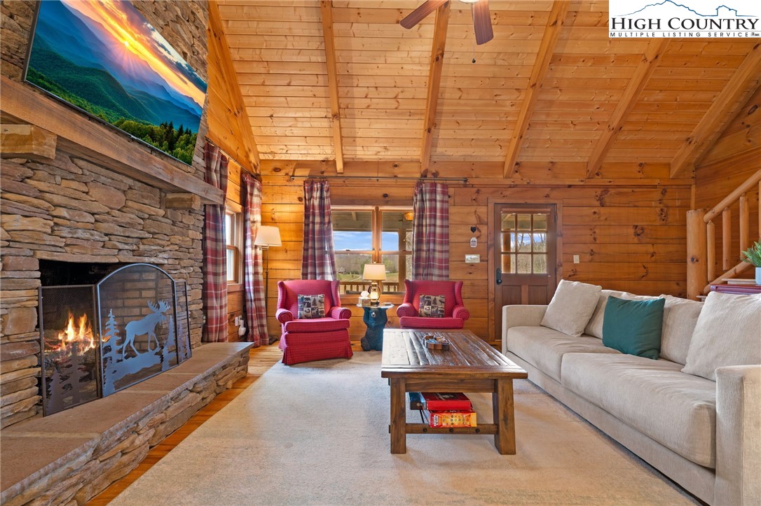 337 Rivers Crest Road Boone, NC 28607 - Photo 6 of 45 a outdoor living space with patio furniture and a fireplace
