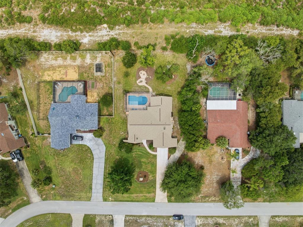 5227 Suwannee Road Weeki Wachee, FL 34607 - Photo 55 of 62 an aerial view of multiple house with outdoor space