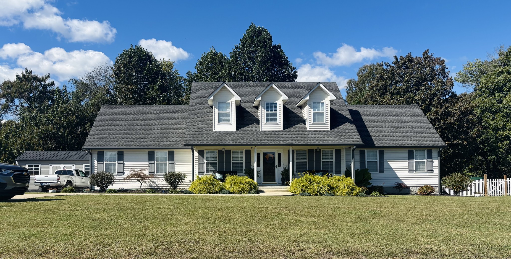 a front view of a house with garden