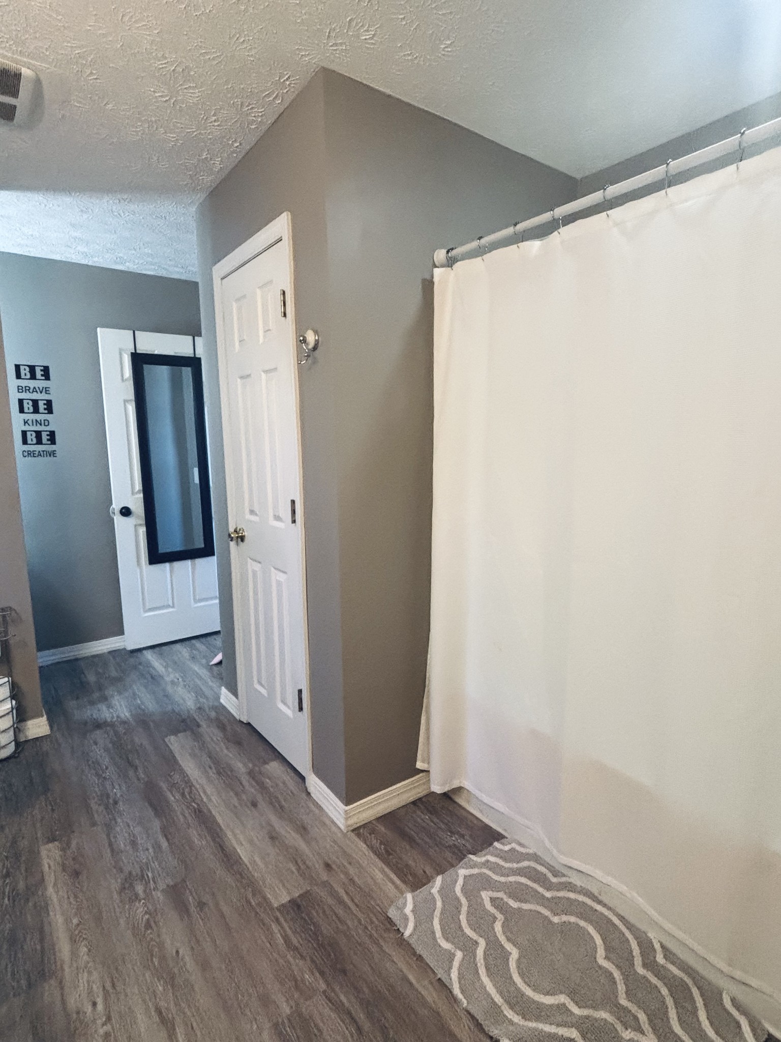 586 Old Snow Hill Road Dowelltown, TN 37059 - Photo 11 of 51 an empty room with wooden floor and a window