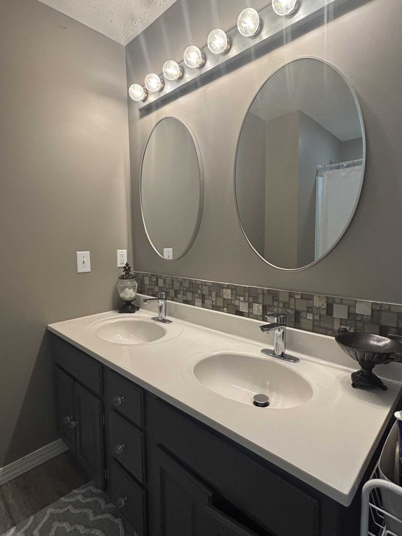 586 Old Snow Hill Road Dowelltown, TN 37059 - Photo 12 of 51 a bathroom with a double vanity sink and a mirror