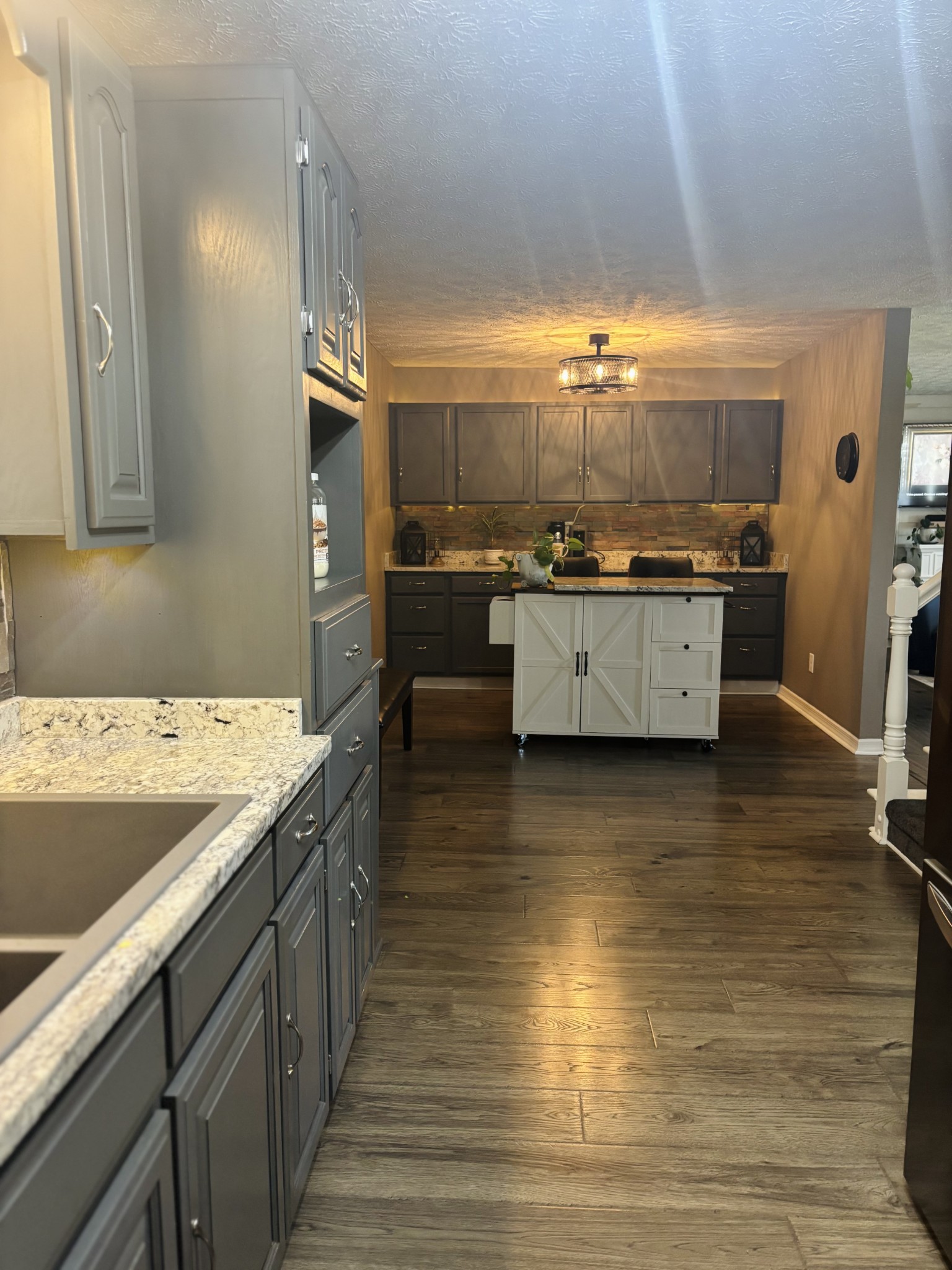 586 Old Snow Hill Road Dowelltown, TN 37059 - Photo 16 of 51 a kitchen with stainless steel appliances granite countertop a sink counter space and stove