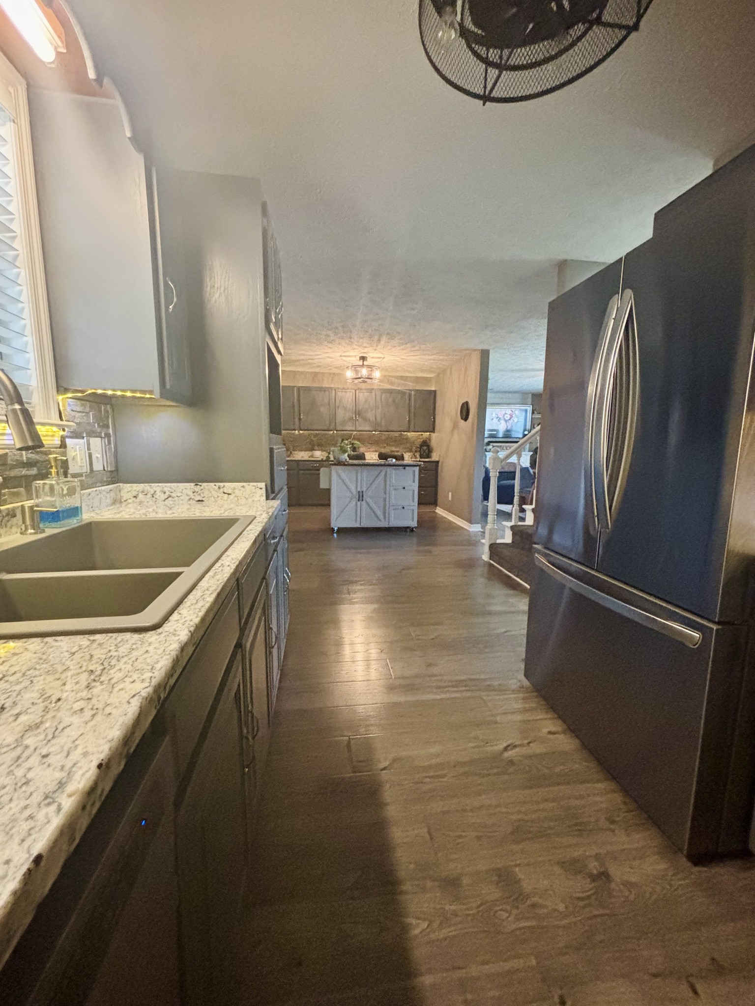 586 Old Snow Hill Road Dowelltown, TN 37059 - Photo 20 of 51 a kitchen with stainless steel appliances granite countertop a sink a stove and a refrigerator