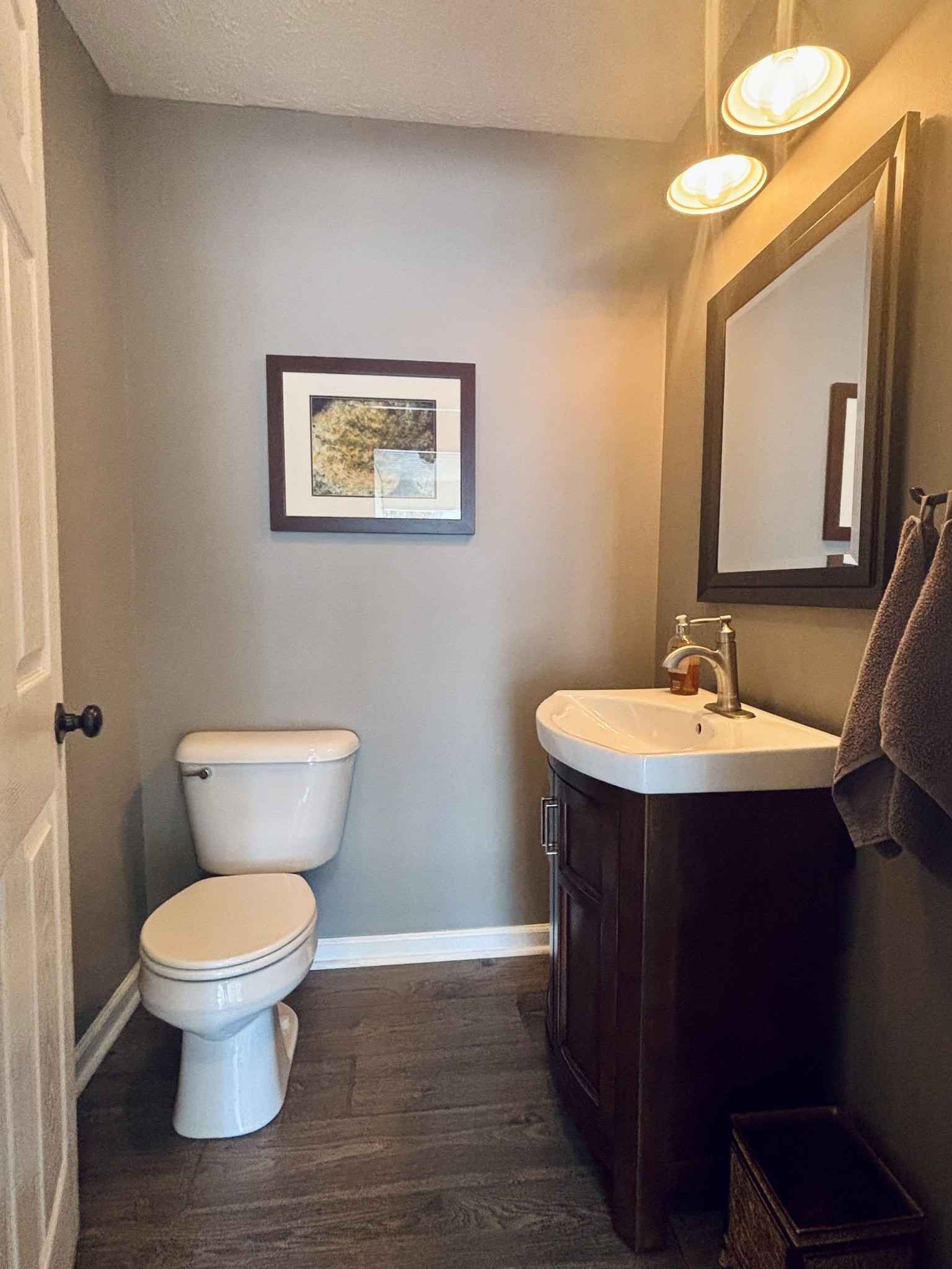 586 Old Snow Hill Road Dowelltown, TN 37059 - Photo 26 of 51 a bathroom with a toilet sink and mirror
