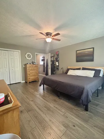 a bedroom with bed and window