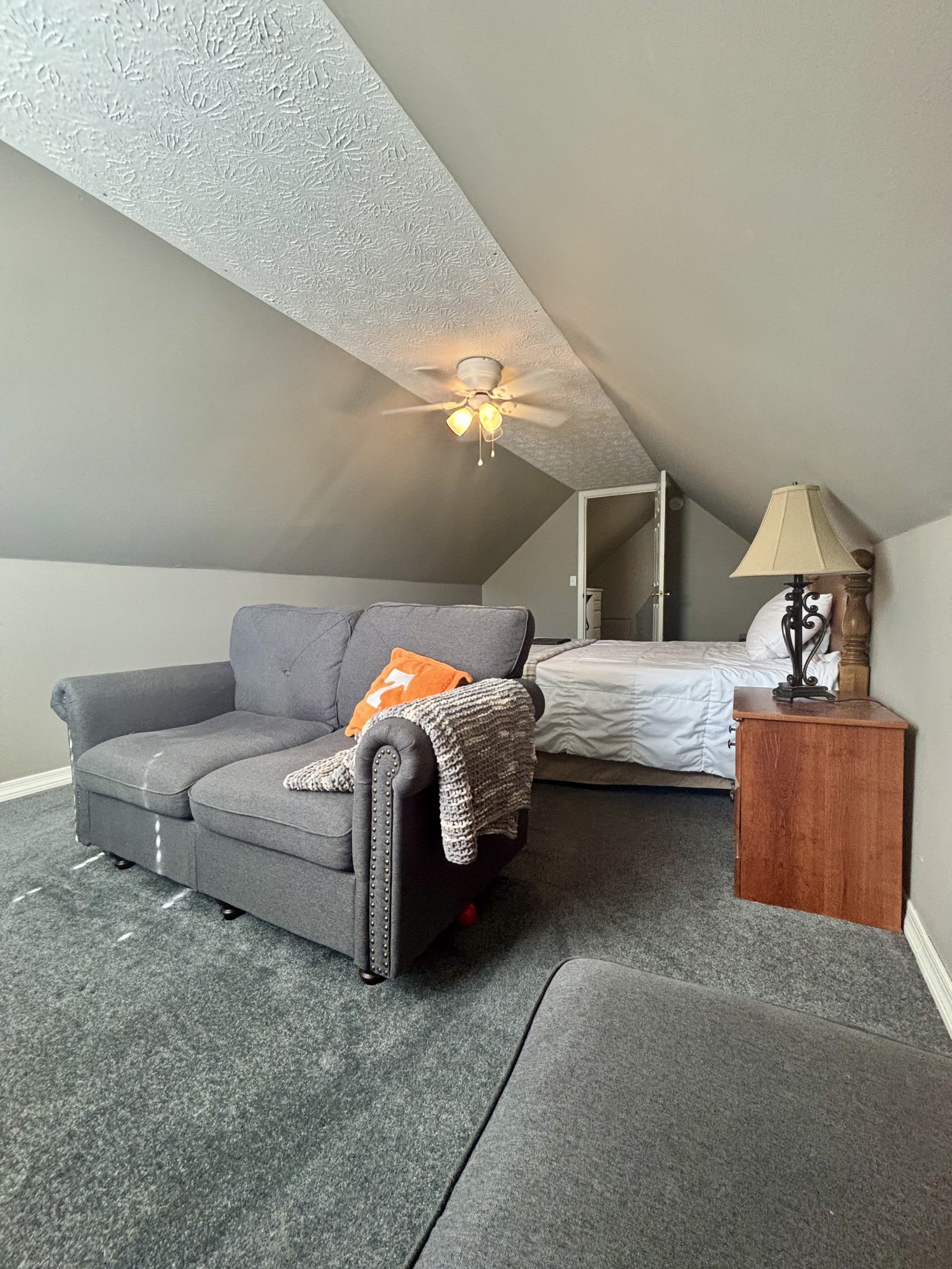 586 Old Snow Hill Road Dowelltown, TN 37059 - Photo 38 of 51 a bedroom with a bed and lamp