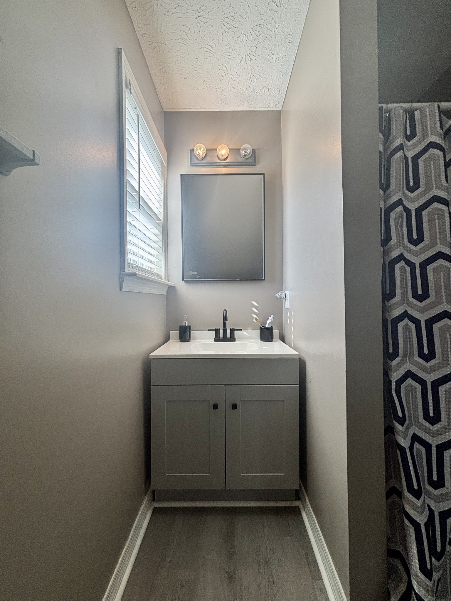 586 Old Snow Hill Road Dowelltown, TN 37059 - Photo 43 of 51 a bathroom with a sink and a mirror
