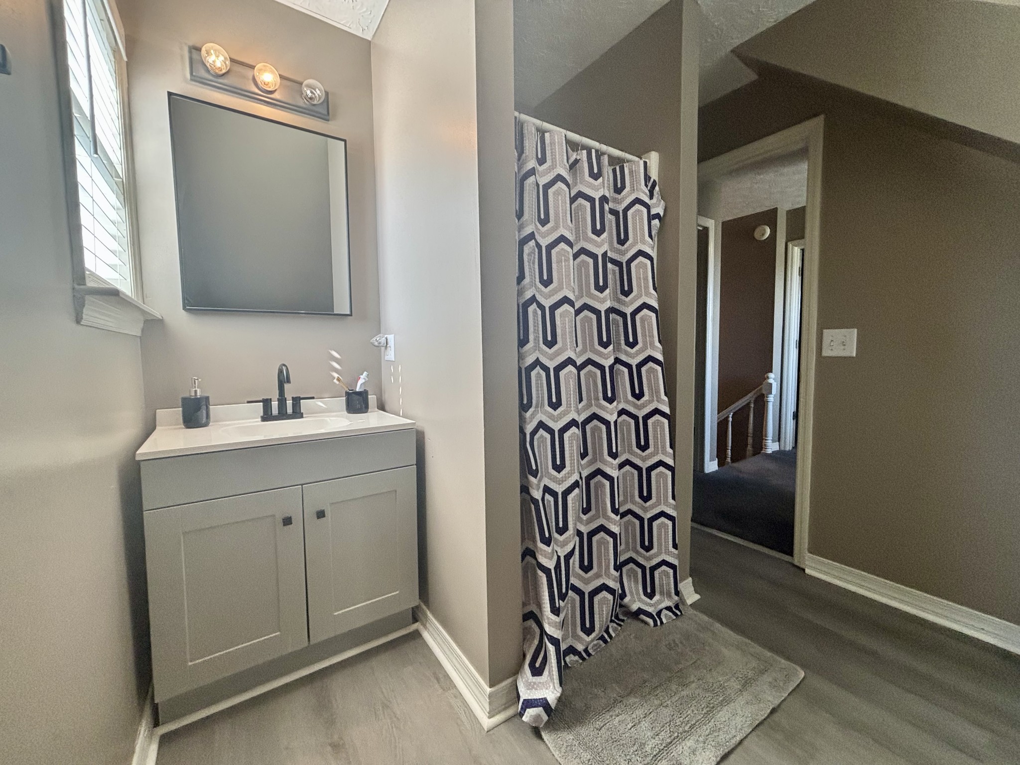586 Old Snow Hill Road Dowelltown, TN 37059 - Photo 44 of 51 a bathroom with a sink and a mirror