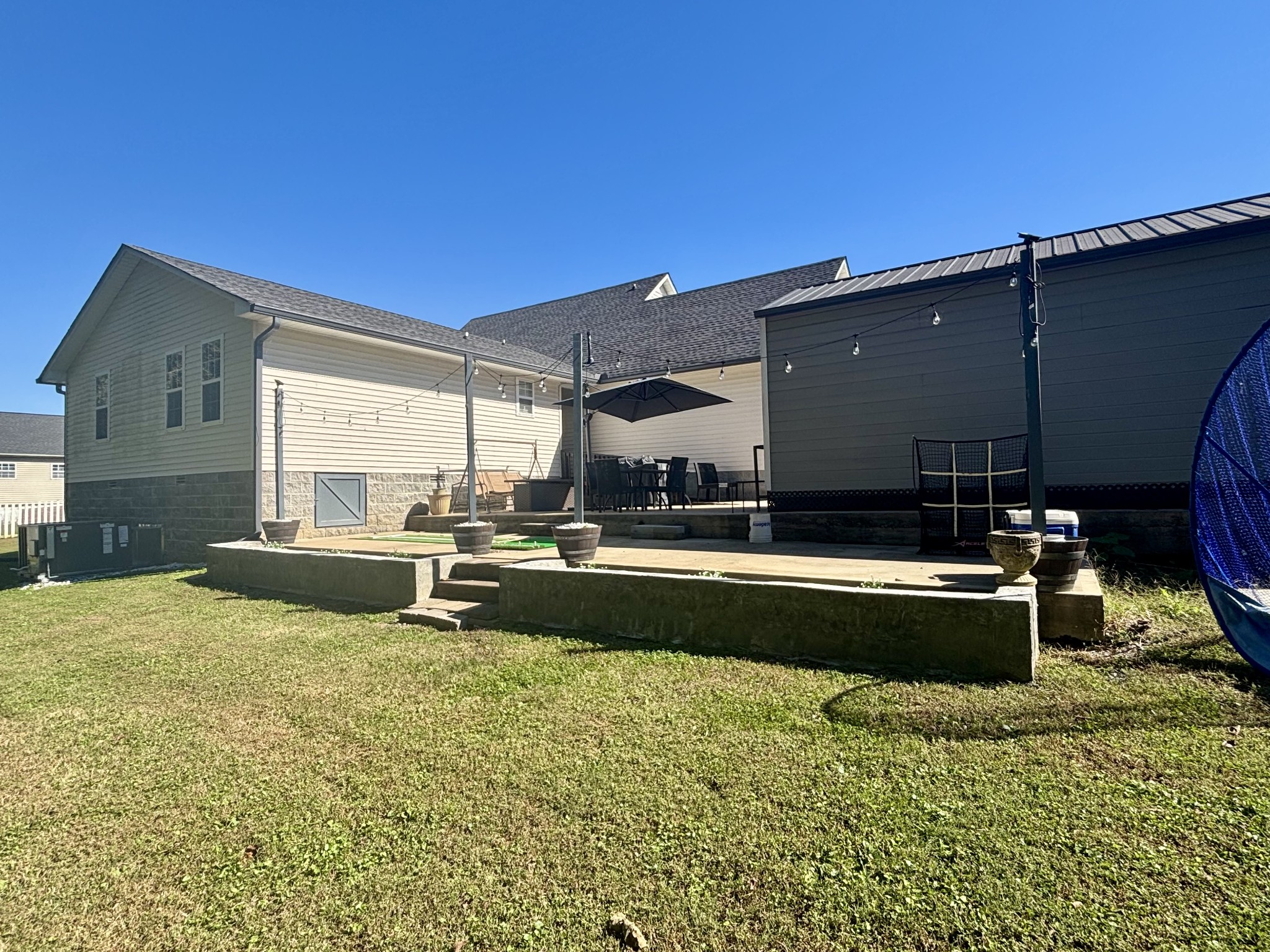 586 Old Snow Hill Road Dowelltown, TN 37059 - Photo 50 of 51 a swimming pool with outdoor seating and yard