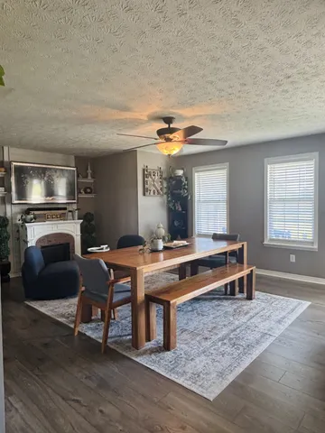 a room with furniture pool table and windows