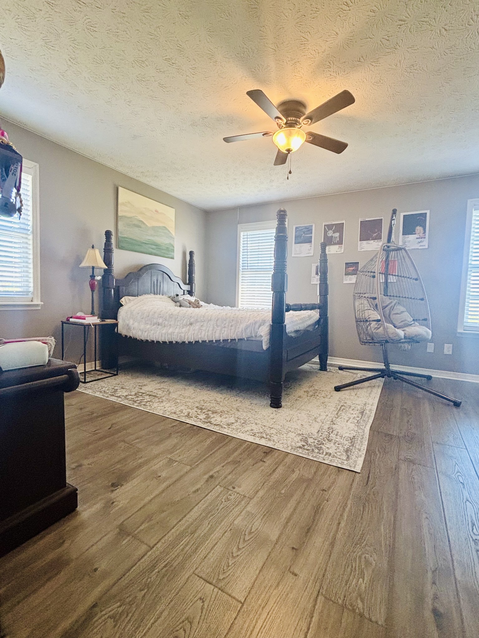 586 Old Snow Hill Road Dowelltown, TN 37059 - Photo 10 of 51 a bedroom with a bed and wooden floor