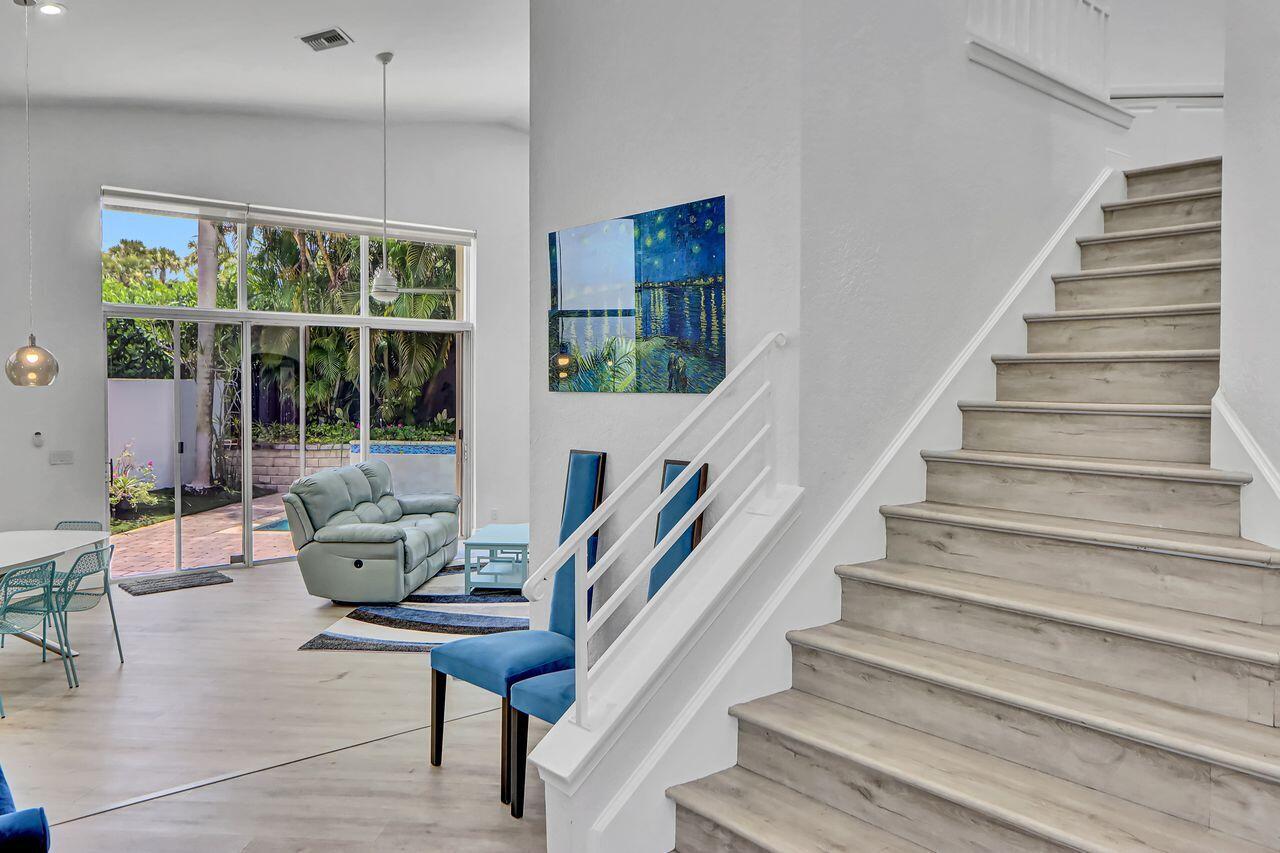 6631 Northwest 43rd Terrace Boca Raton, FL 33496 - Photo 14 of 36 a living room with furniture and a large window