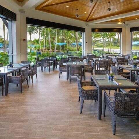 6631 Northwest 43rd Terrace Boca Raton, FL 33496 - Photo 26 of 36 a living room with lots of furniture and a large window