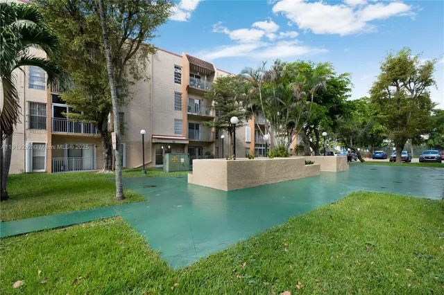 a view of a street with a building in the background