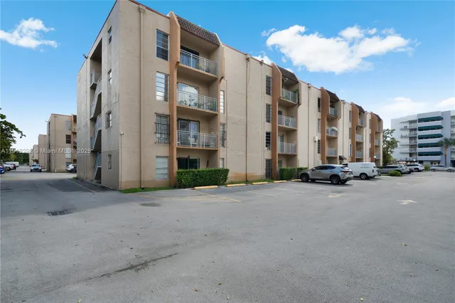 a view of a chairs and table in the backyard