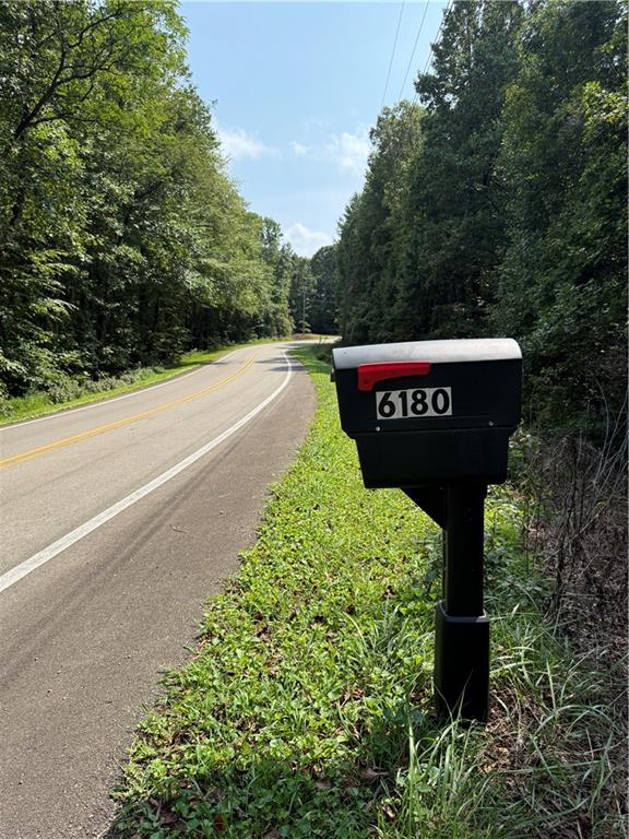 6180 Burnt Mountain Road Ellijay, GA 30536 - Photo 6 of 20 a sign on the side of a building