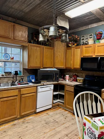 a kitchen with stainless steel appliances granite countertop a stove and a sink