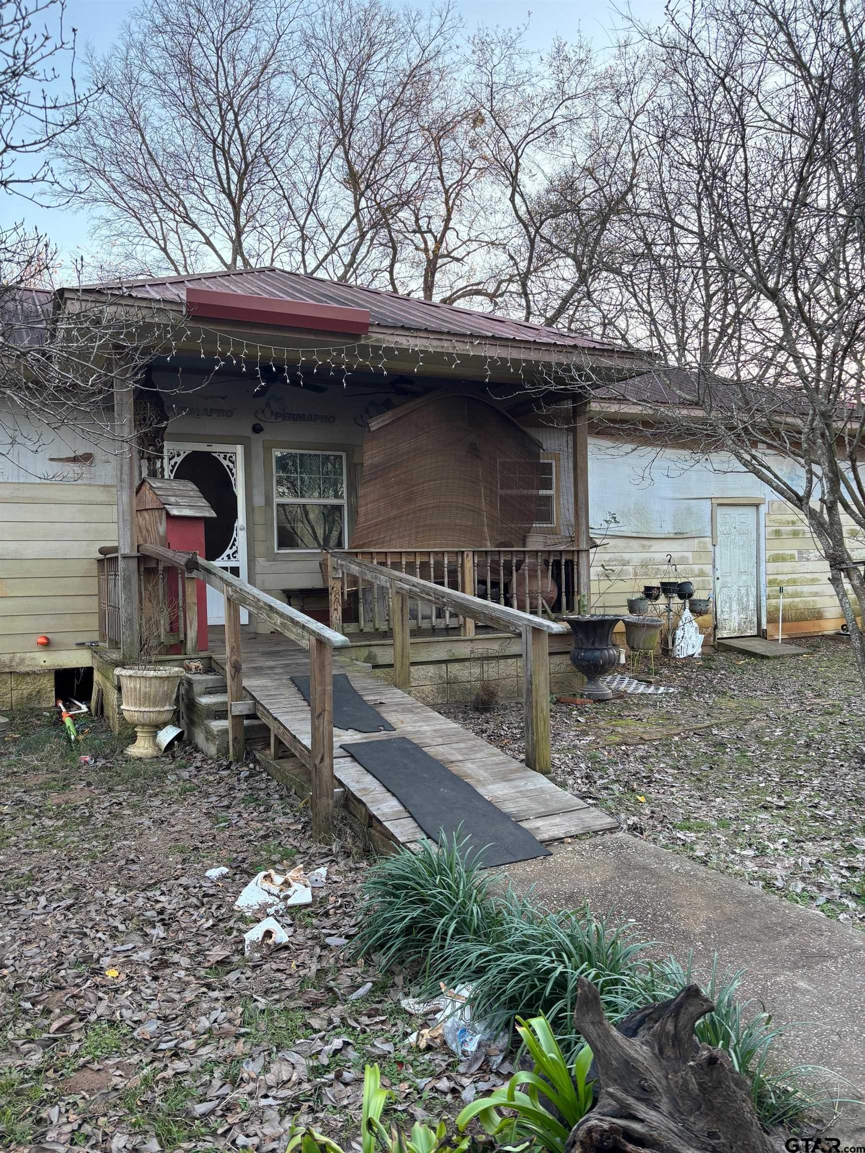10748 Highway 84 Rusk, TX 75785 - Photo 3 of 15 a front view of a house with garden