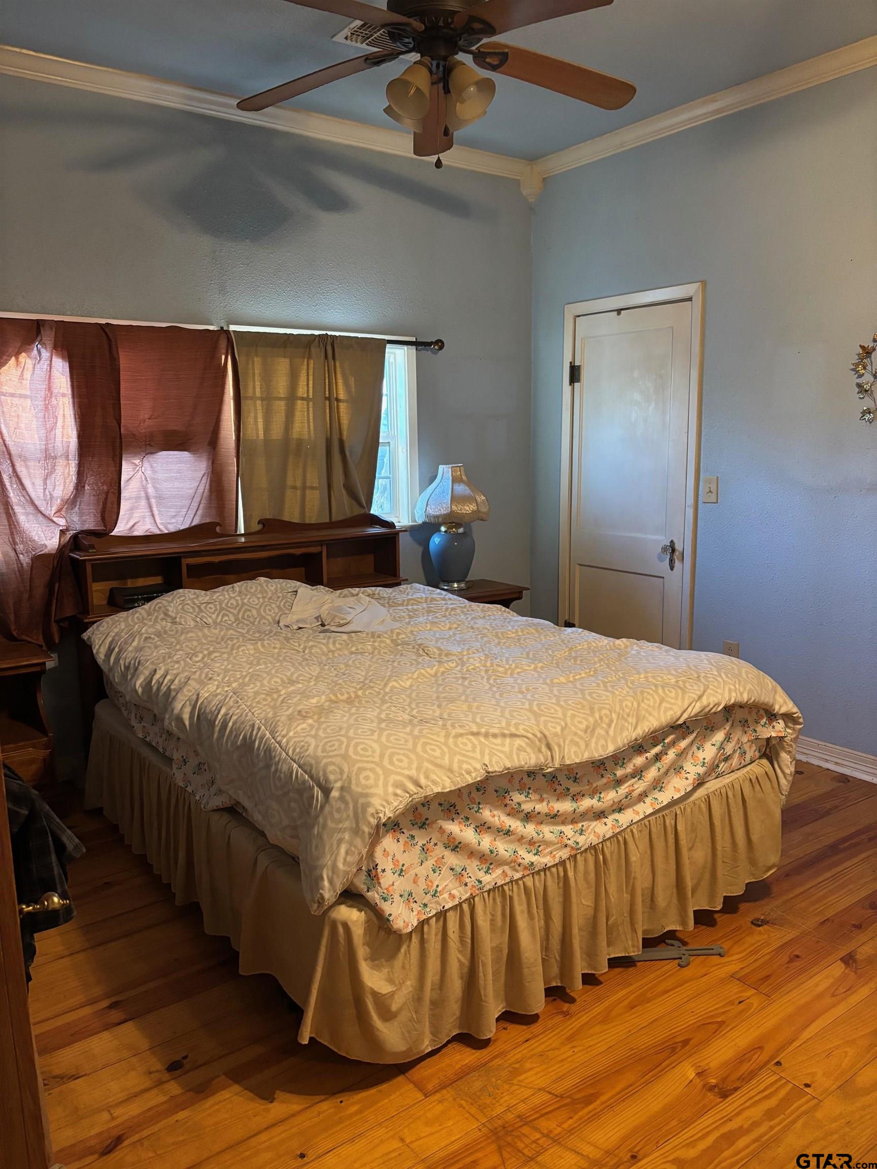 10748 Highway 84 Rusk, TX 75785 - Photo 8 of 15 a bed sitting in a bedroom next to a window