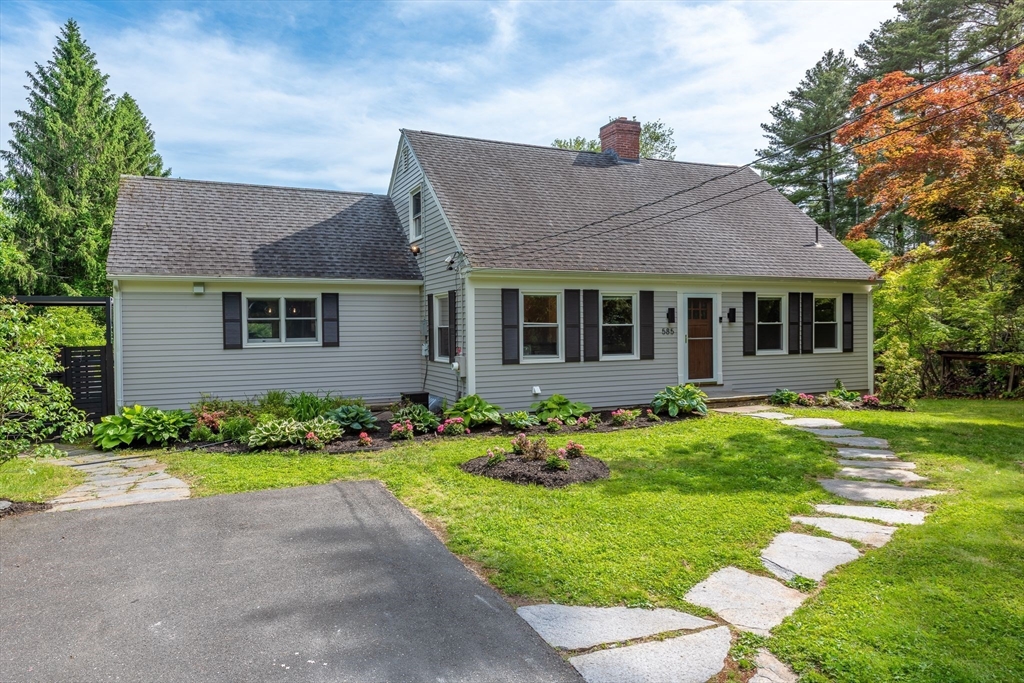 585 Station Road Amherst, MA 01002 - Photo 2 of 42 a front view of a house with a yard