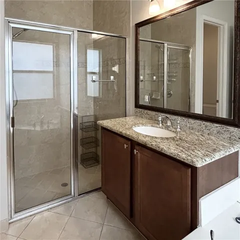 a bathroom with a bathtub sink and mirror
