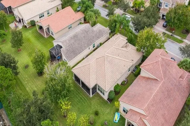 a view of house with swimming pool outdoor seating
