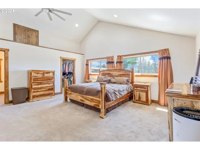 a bedroom with a bed and a tv