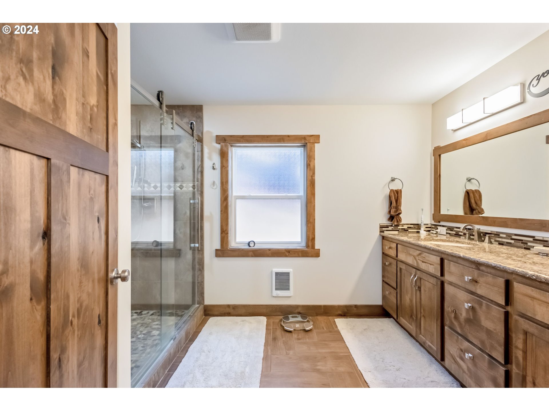 3068 Southwest Reif Road Powell Butte, OR 97753 - Photo 15 of 42 a bathroom with a sink and a mirror