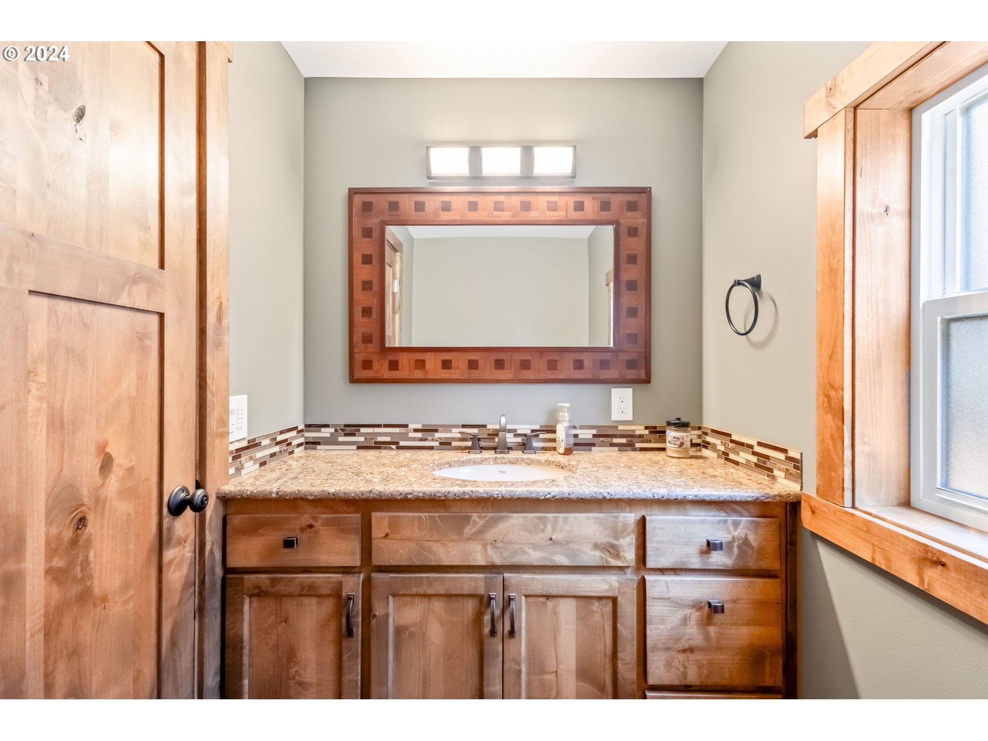 3068 Southwest Reif Road Powell Butte, OR 97753 - Photo 19 of 42 a bathroom with a sink and a mirror