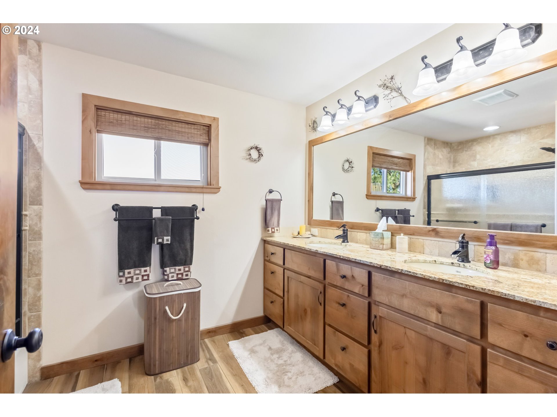 3068 Southwest Reif Road Powell Butte, OR 97753 - Photo 22 of 42 a kitchen with a sink a stove and cabinets